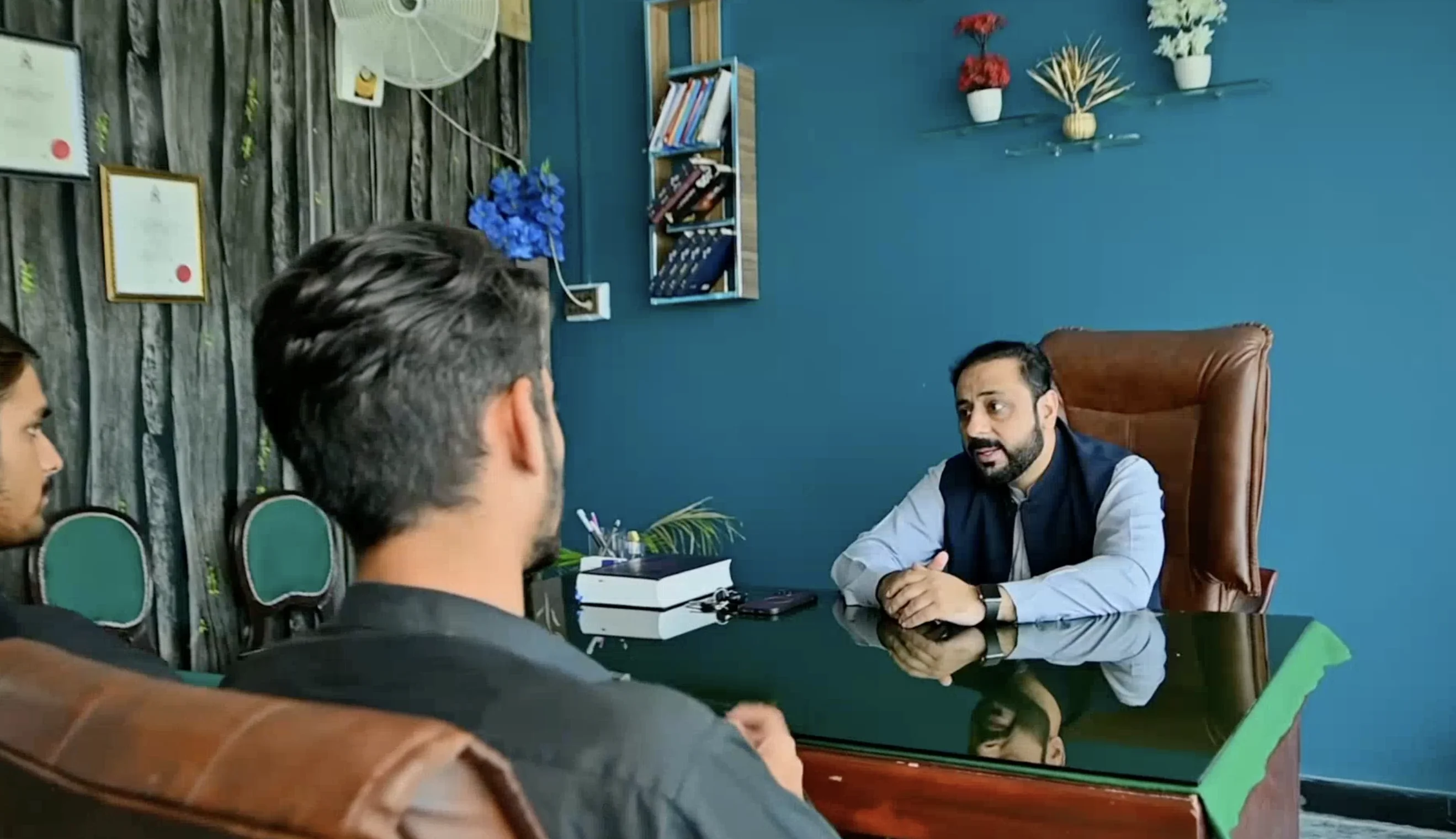 Visa consultant meeting with Pakistani students in office